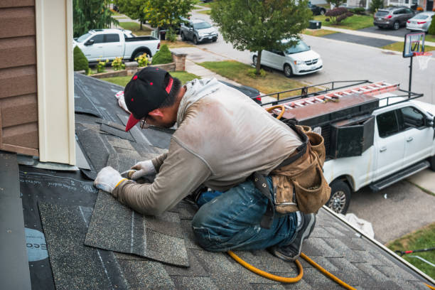 Professional Storm Damage Roof Repair technician working in Millis, MA